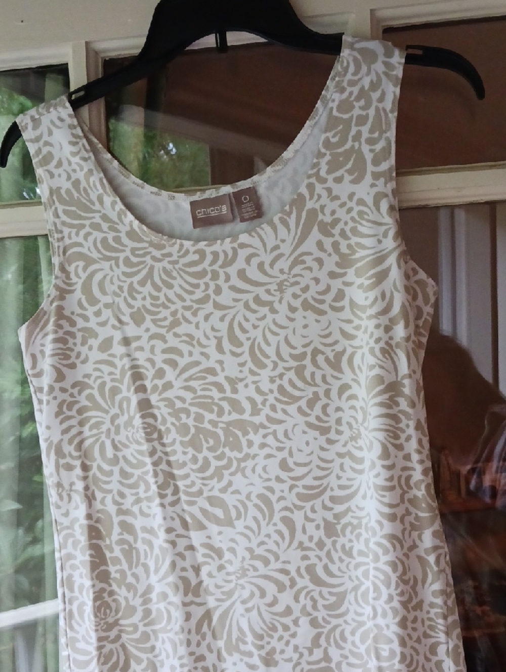 Lightweight nylon and spandex sleeveless top.